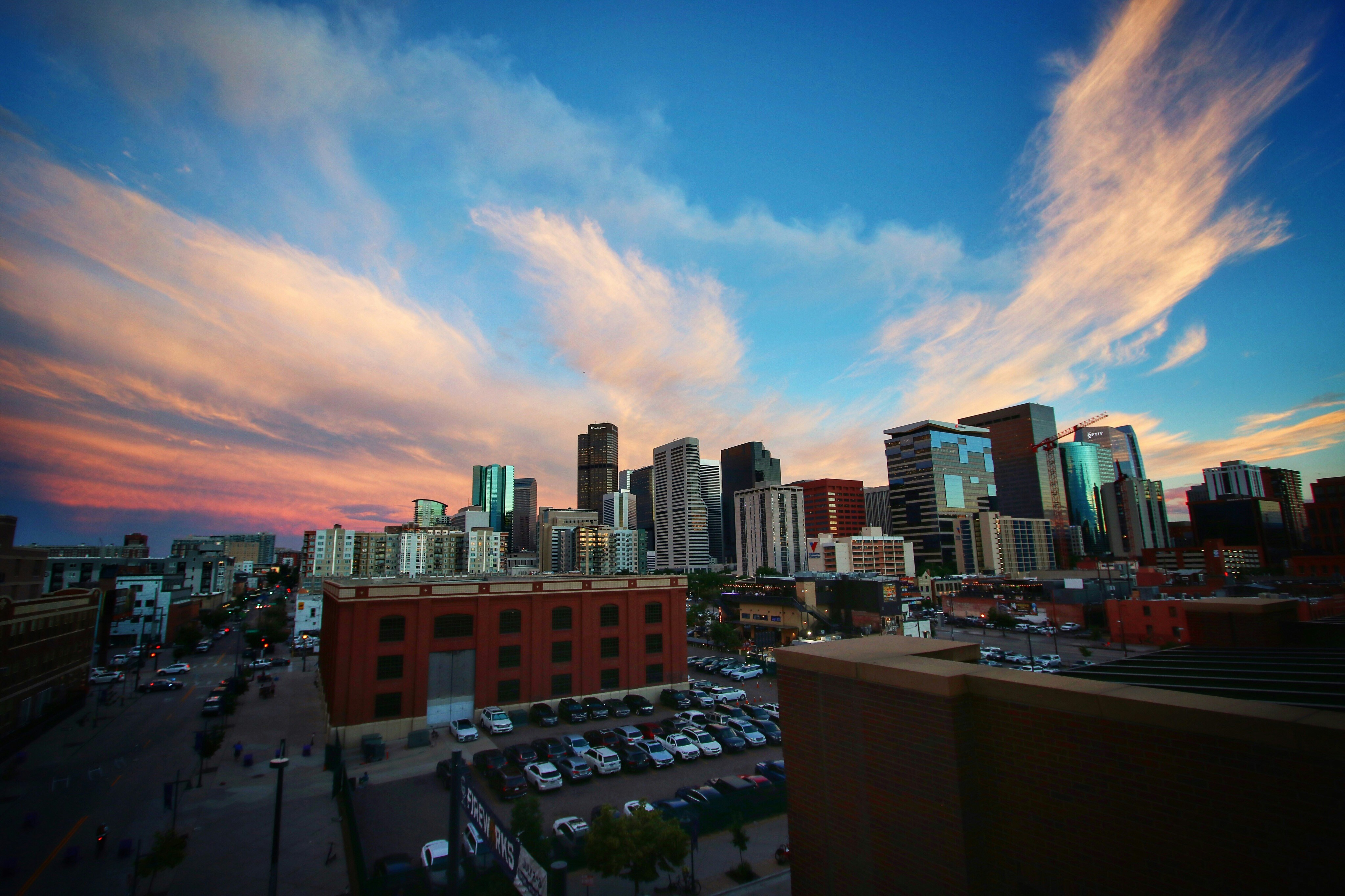 Denver skyline with dramatic clouds at sunset